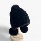Bontmuts van wezel met vosbont pompon