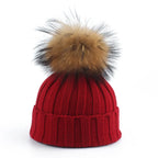 Gebreide winter pom-pom muts