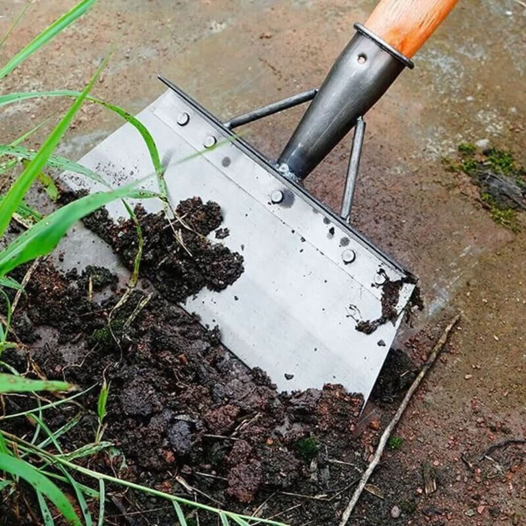 Multifunctionele schoonmaakschep met schraperfunctie