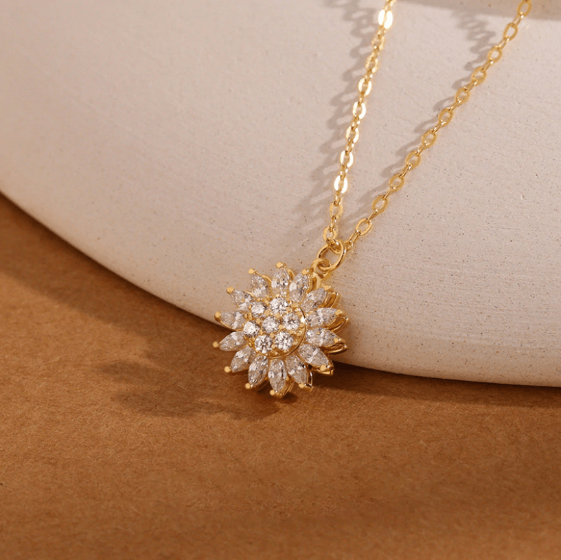 Roterende zonnebloem ketting