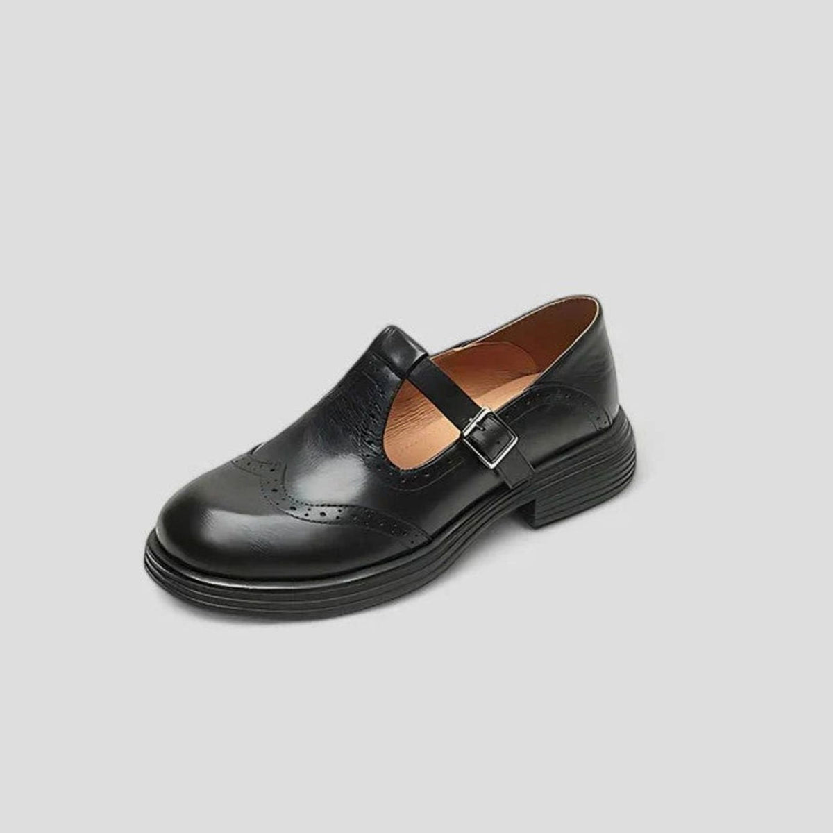 Klassieke dameslaarzen van leer met brogue-detail en T-gespband
