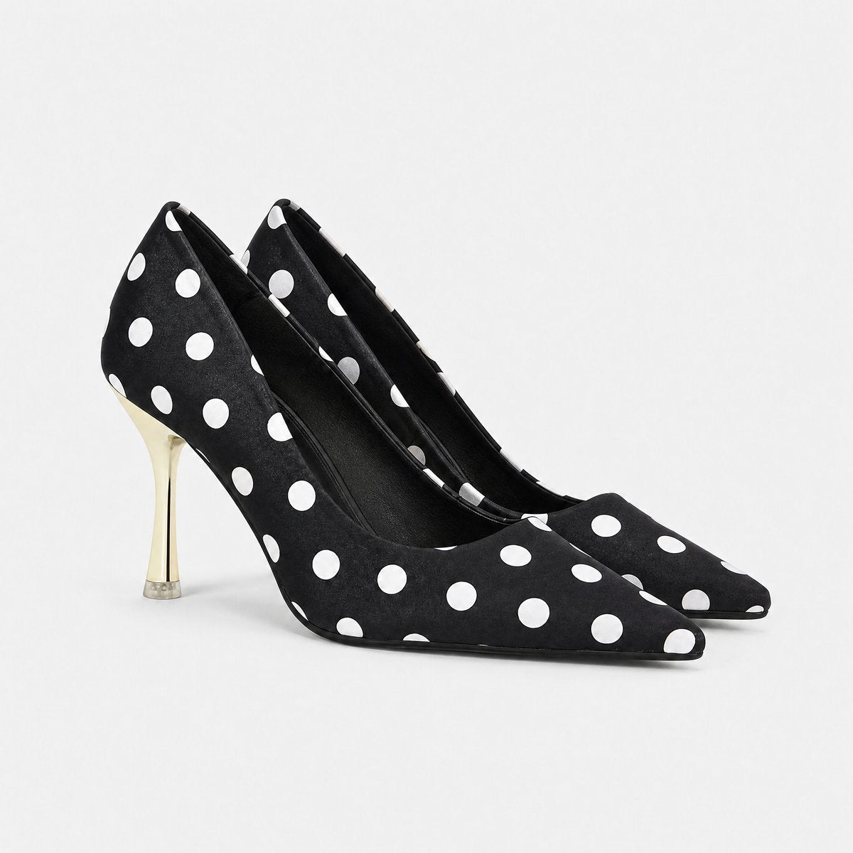 Damespumps met stippenprint, puntneus en goudkleurige stilettohak