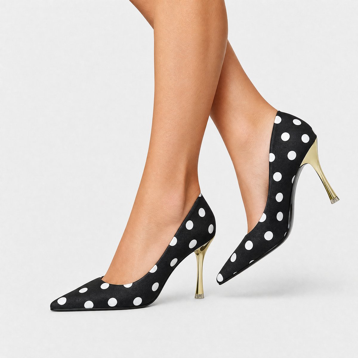 Damespumps met stippenprint, puntneus en goudkleurige stilettohak