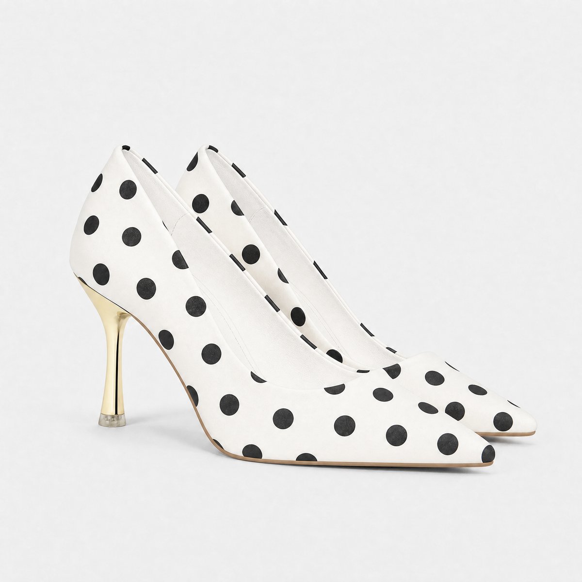 Damespumps met stippenprint, puntneus en goudkleurige stilettohak