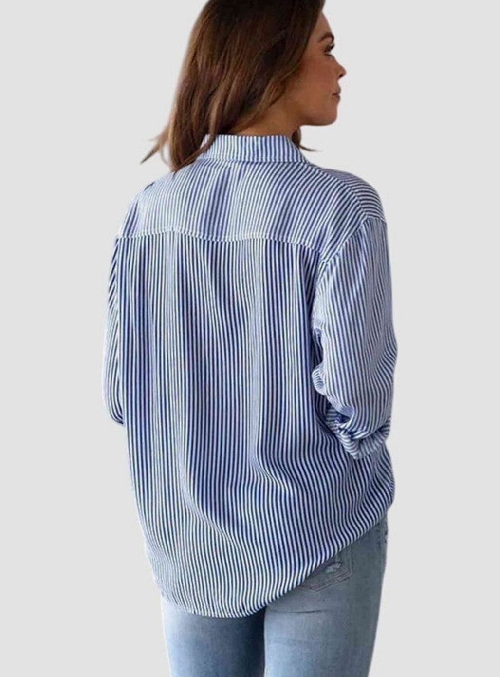 Claudia | Gestreepte damesblouse met knoopsluiting en strikzoom