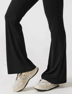 Rugvrije jumpsuit met uitlopende broekspijpen