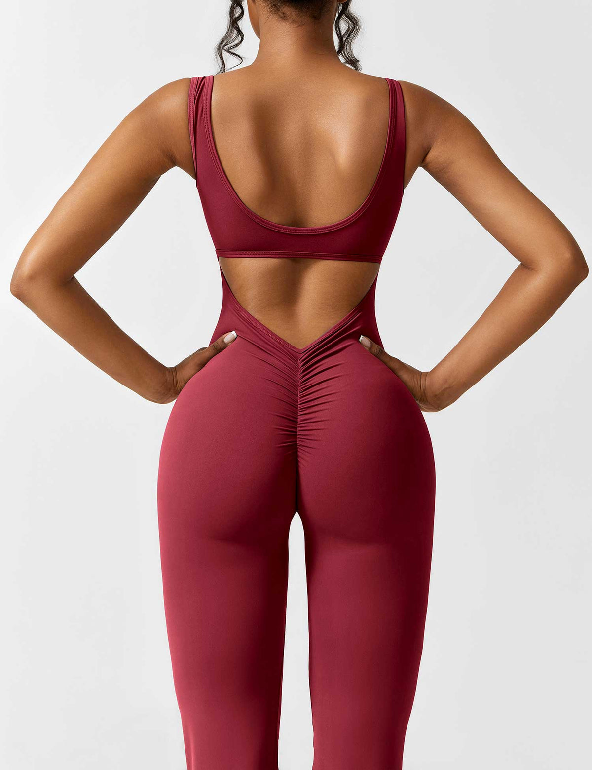Rugvrije jumpsuit met uitlopende broekspijpen
